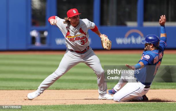 Luis Guillorme of the New York Mets breaks up a double play against Brendan Donovan of the St. Louis Cardinals during their game at Citi Field on May...