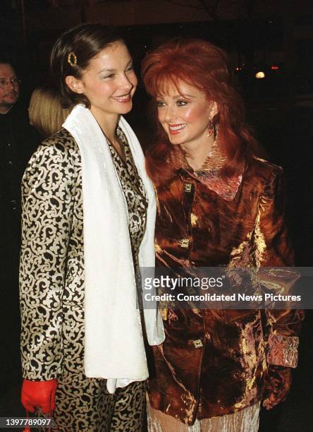 View of American singer & actress Ashley Judd and her mother, Country musician Naomi Judd , as they attend a premiere of the film 'Amistad,' at the...