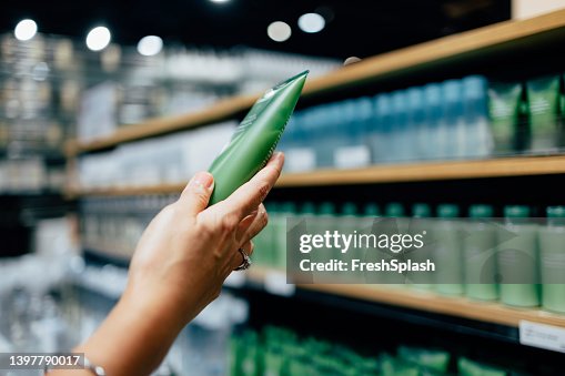 A Close Up View Of An Unrecognizable Female's Hand Holding Some Beauty Product A Close Up View Of An Unrecognizable Female's Hand Holding Some Beauty Product