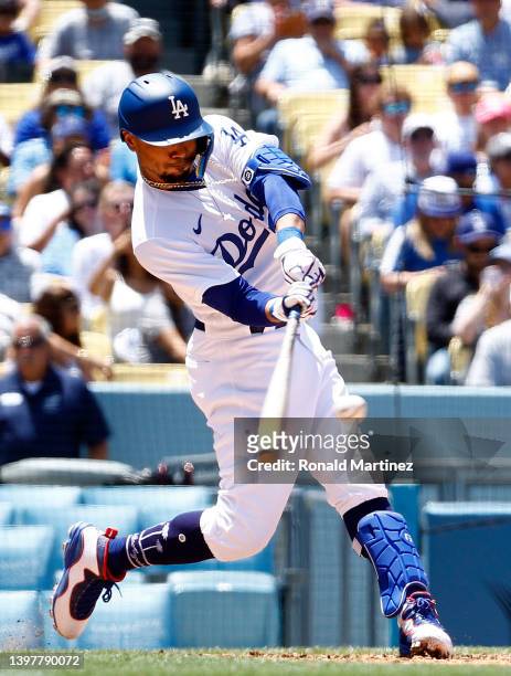 Mookie Betts of the Los Angeles Dodgers hits a two-run home run against the Arizona Diamondbacks in the sixth inning during game one of a...