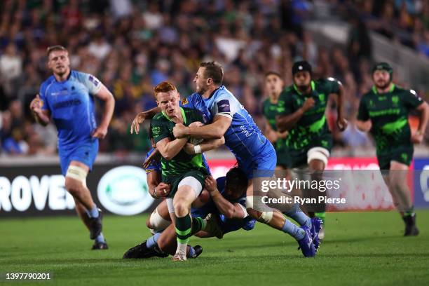 Caolan Englefield of London Irish is tackled by Francois Venter of Worcester Warriors during the Premiership Rugby Cup Final between London Irish and...