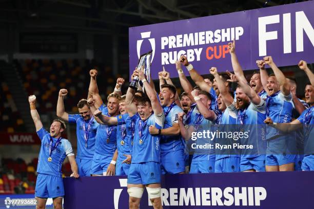 Ted Hill of Worcester Warriors lifts the Premiership Rugby Cup as their team mates celebrate after victory in the Premiership Rugby Cup Final between...