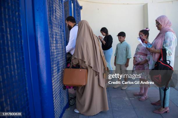 Family waits to have their documents checked before crossing the international border of El Tarajal into Morocco on May 17, 2022 in Ceuta, Spain. The...