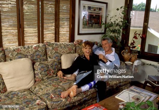 American actor and television host Jed Allan sits with his wife Toby at their home circa July, 1991 in Los Angeles, California.