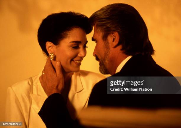 American actress Stepfanie Kramer and American actor James Brolin, smile on the set while filming the 1992 thriller "Twin Sisters" circa August, 1991...