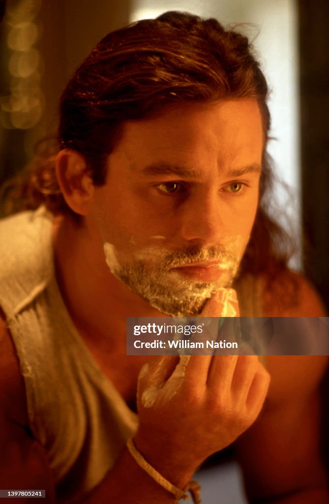 American actor Richard Tyson, shaves his face on August 28, 1991 in