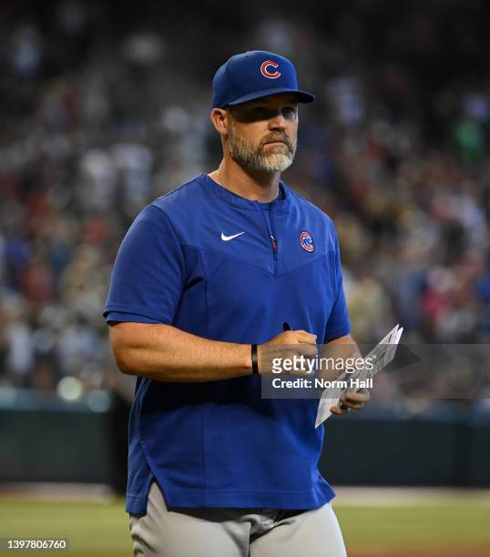 Manager David Ross of the Chicago Cubs walks back to the dugout after making a pitching change against the Arizona Diamondbacks at Chase Field on May...