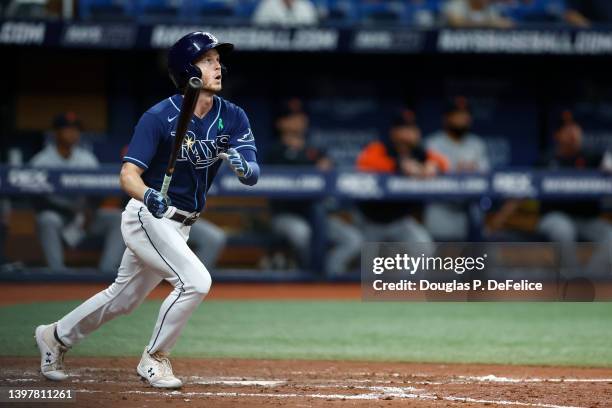 Brett Phillips of the Tampa Bay Rays hits a solo home run in the fifth inning against the Detroit Tigers at Tropicana Field on May 17, 2022 in St...