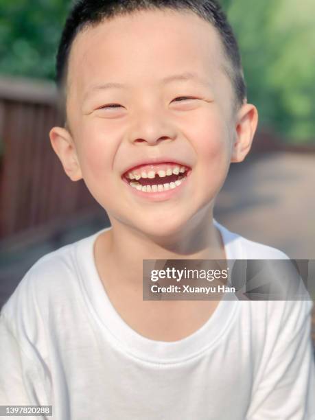 little boy looking at camera and laughing - who could play young han solo stock pictures, royalty-free photos & images