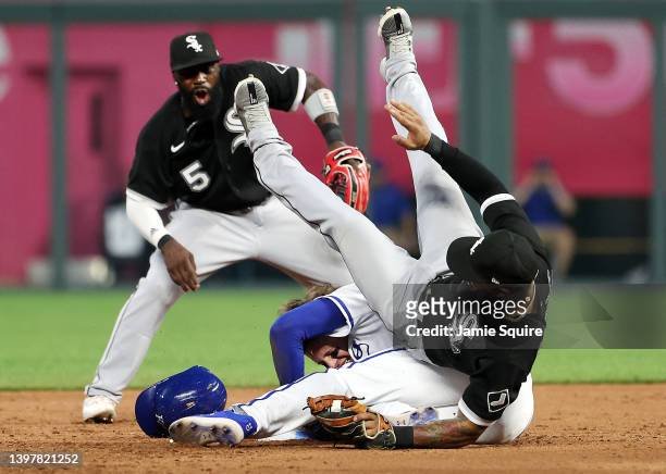 Leury Garcia of the Chicago White Sox is upended by Bobby Witt Jr. #7 of the Kansas City Royals as Witt dives back into second base on a caught fly...