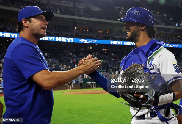 Melendez of the Kansas City Royals is congratulated by Manager Mike Matheny after the Royals defeated the Chicago White Sox 2-1 to win game two of a...