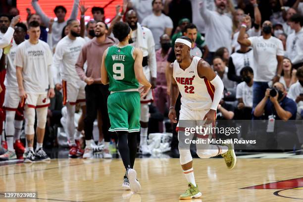 Jimmy Butler of the Miami Heat celebrates a basket against the Boston Celtics during the third quarter in Game One of the 2022 NBA Playoffs Eastern...