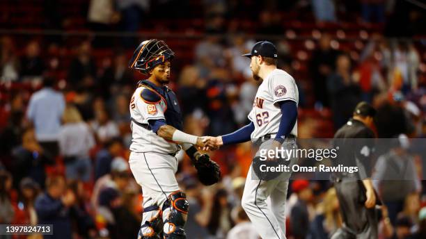 Relief pitcher Blake Taylor of the Houston Astros and catcher Martin Maldonado shake hands after the victory over the Boston Red Sox at Fenway Park...