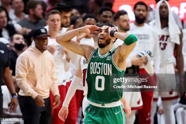 Jayson Tatum of the Boston Celtics reacts to a play against the Miami Heat during the third quarter in Game One of the 2022 NBA Playoffs Eastern...