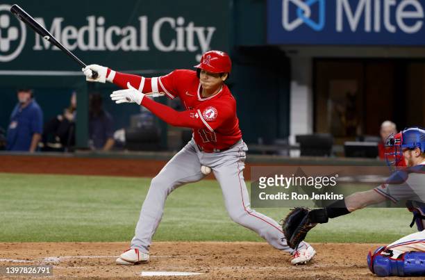 Shohei Ohtani of the Los Angeles Angels fouls off a pitch while at bat against the Texas Rangers in the top of the seventh inning at Globe Life Field...