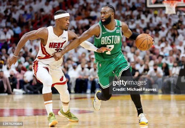 Jaylen Brown of the Boston Celtics drives to the basket against Jimmy Butler of the Miami Heat during the fourth quarter in Game One of the 2022 NBA...