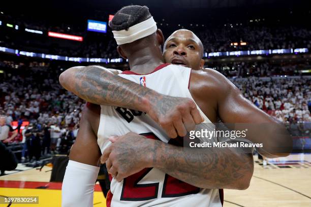 Jimmy Butler of the Miami Heat hugs teammate P.J. Tucker after defeating the Boston Celtics in Game One of the 2022 NBA Playoffs Eastern Conference...