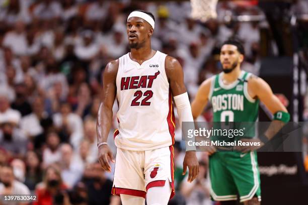 Jimmy Butler of the Miami Heat looks on ahead of Jayson Tatum of the Boston Celtics during the fourth quarter in Game One of the 2022 NBA Playoffs...