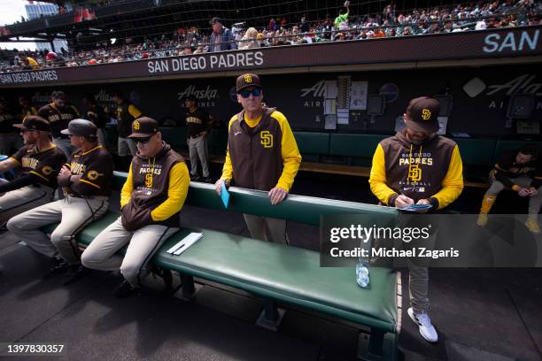 Third Base Coach Matt Williams, Manager Bob Melvin and Bench Coach Ryan Christenson of the San Diego Padres in the dugout before the game against the...