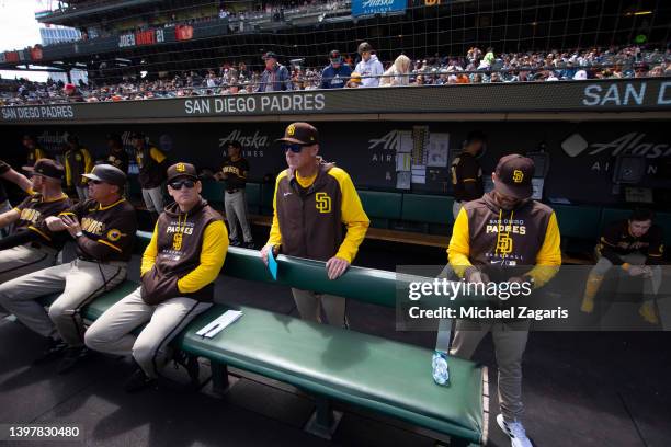 Third Base Coach Matt Williams, Manager Bob Melvin and Bench Coach Ryan Christenson of the San Diego Padres in the dugout before the game against the...