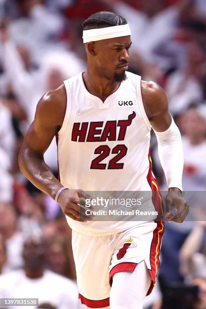 Jimmy Butler of the Miami Heat reacts to a basket against the Boston Celtics during the fourth quarter in Game One of the 2022 NBA Playoffs Eastern...