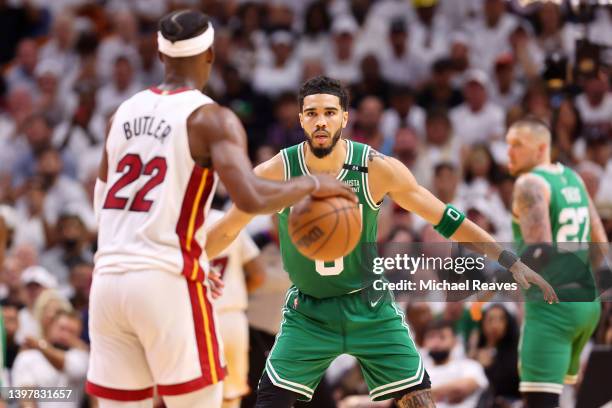 Jayson Tatum of the Boston Celtics defends Jimmy Butler of the Miami Heat during the fourth quarter in Game One of the 2022 NBA Playoffs Eastern...