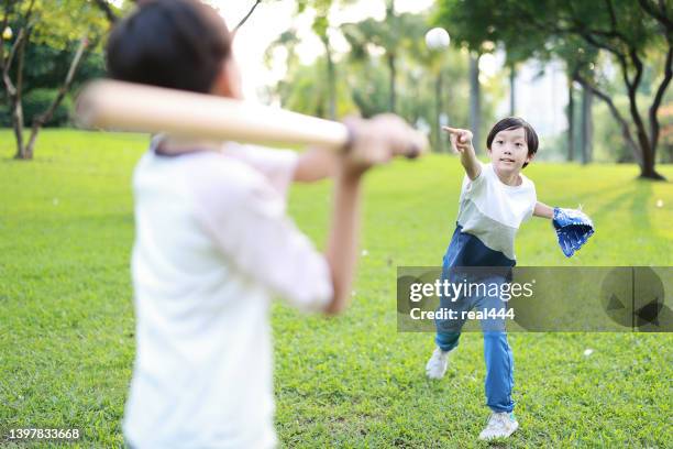 young boy playing baseball - kid baseball pitcher stock pictures, royalty-free photos & images