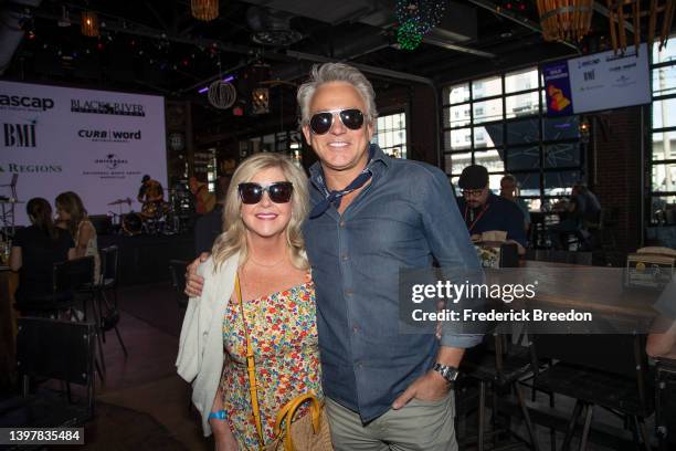 Shannon Stewart and Fletcher Foster pose for a photo at the Grammys Nashville Chapter Block Party on May 17, 2022 in Nashville, Tennessee.