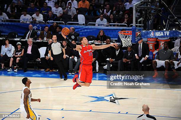 Blake Griffin of Team Shaq dunks against Paul George of Team Chuck during the BBVA Rising Stars Challenge as part of 2012 All-Star Weekend at the...