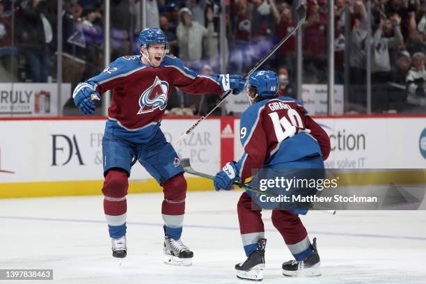 Josh Manson of the Colorado Avalanche celebrates with Samuel Girard after scoring the winning goal against the St Louis Blues in overtime during Game...