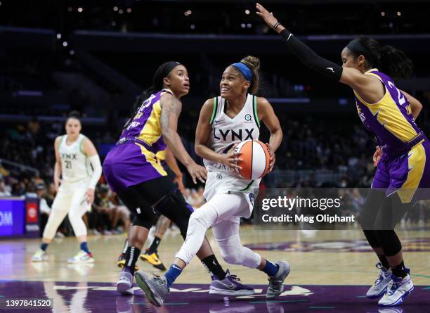 Guard Moriah Jefferson of the Minnesota Lynx drives to the basket defended by guard Jordin Canada of the Los Angeles Sparks in the second half at...