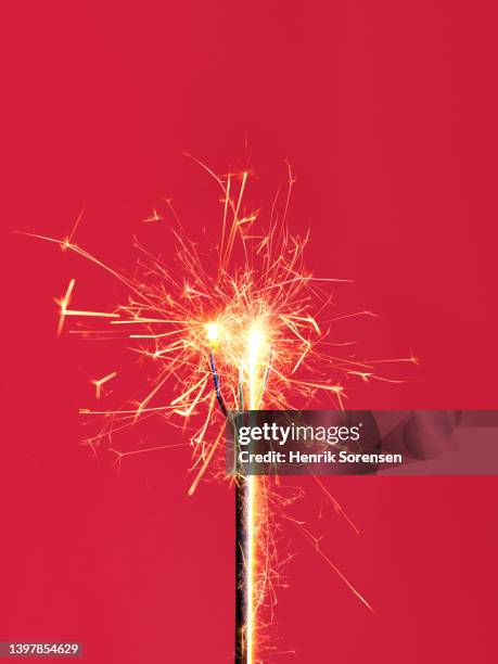 electric wire with sparks - sparks stock pictures, royalty-free photos & images