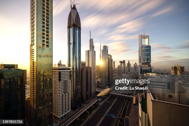 aerial view of cityscape at sunrise in dubai uae - united arab emirates aerial stock pictures, royalty-free photos & images