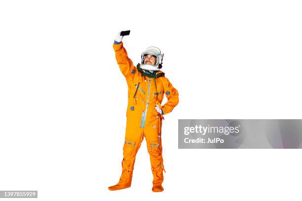 young man in space suit making selfie - astronaut hand stock pictures, royalty-free photos & images