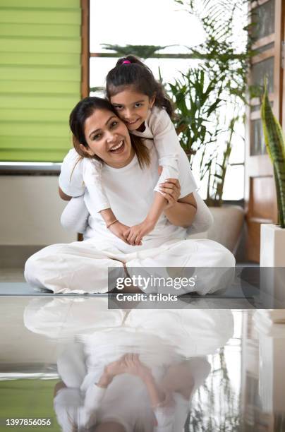 girl having fun with her mother at home - and india love stockfoto's en -beelden