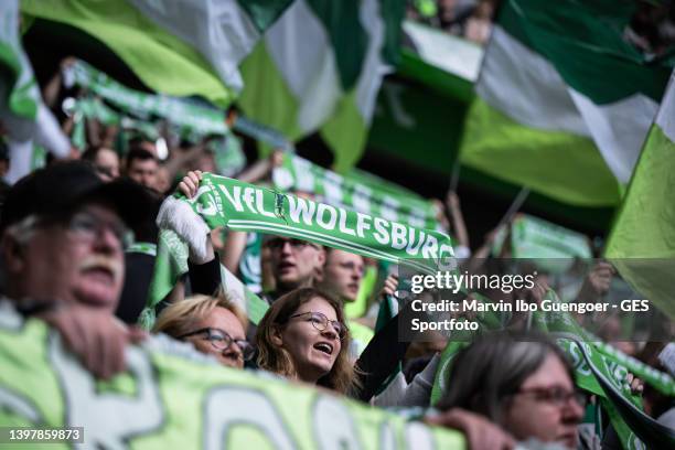 Fans of Wolfsburg supporting their team prior to the Bundesliga match between VfL Wolfsburg and FC Bayern München at Volkswagen Arena on May 14, 2022...