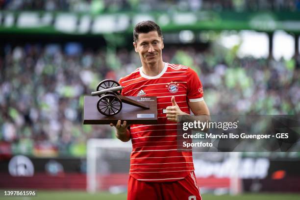 Robert Lewandowski of Munich is being honored as top scorer of the season 2021-22 after the Bundesliga match between VfL Wolfsburg and FC Bayern...