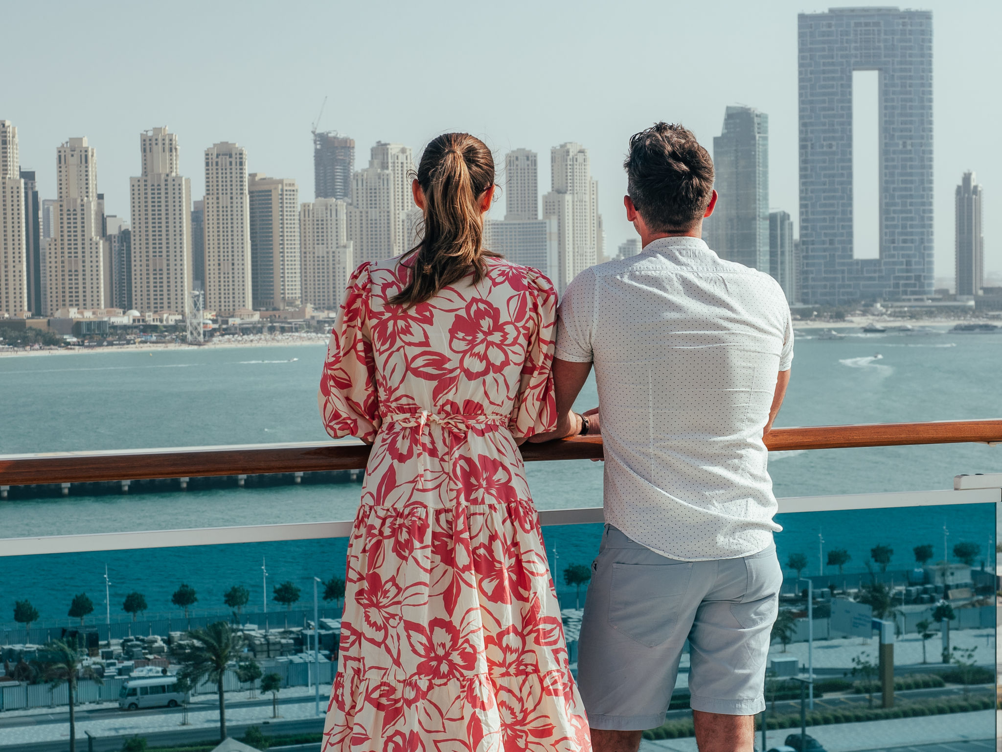 Stylish man and woman, standing on the empty deck Stylish man and woman, standing on the empty deck
