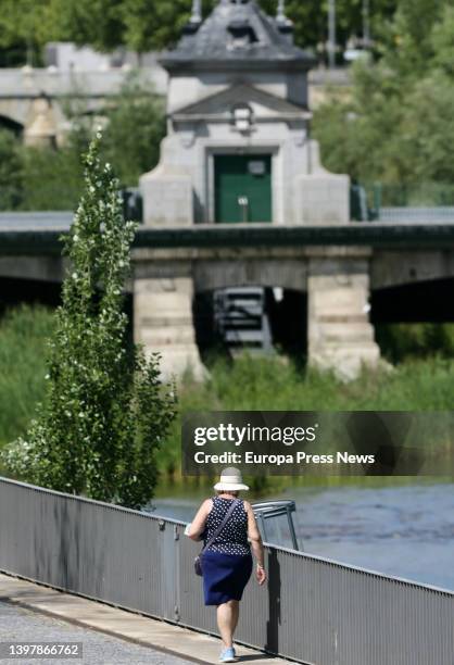 Woman walks on the day when Spain will begin to experience a "major" hot spell with midsummer temperatures on May 17 in Madrid, Spain. Some areas of...