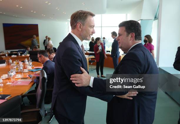 German Finance Minister Christian Lindner and Labour and Social Affairs Minister Hubertus Heil chat prior to the weekly federal government cabinet...