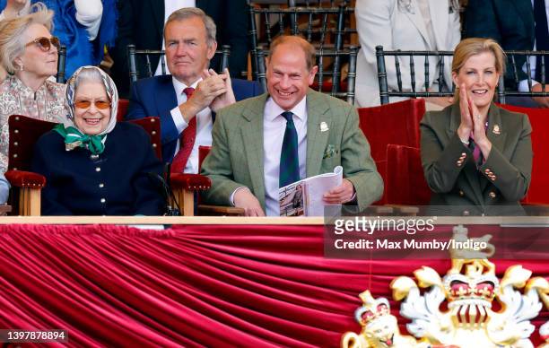 Queen Elizabeth II, accompanied by Prince Edward, Earl of Wessex and Sophie, Countess of Wessex, watches her horse 'Balmoral Leia' win the 'Horse &...