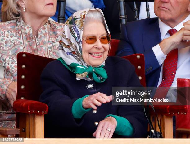 Queen Elizabeth II watches her horse 'Balmoral Leia' win the 'Horse & Hound Mountain & Moorland Supreme In Hand Championship' on day 2 of the Royal...