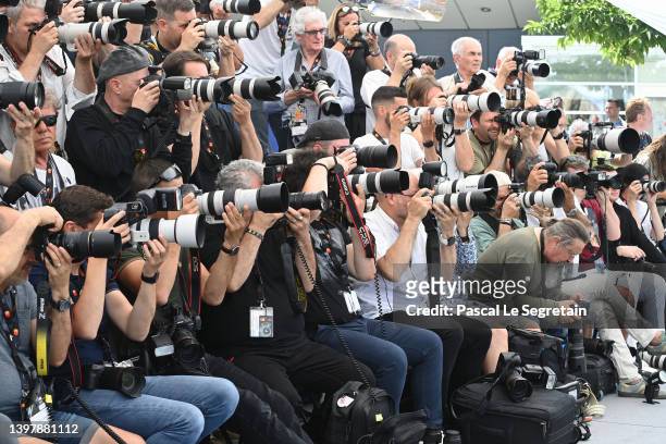 Photographers in action during the photocall of "Esterno Notte " during the 75th annual Cannes film festival at Palais des Festivals on May 18, 2022...
