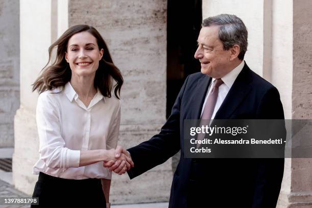 Italy's Prime Minister Mario Draghi welcomes Finland's Prime Minister Sanna Marin, at Chigi Palace, on May 18, 2022 in Rome, Italy. The 36-year-old...