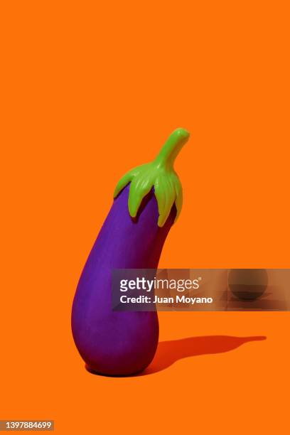 standing fake eggplant - eggplant stockfoto's en -beelden