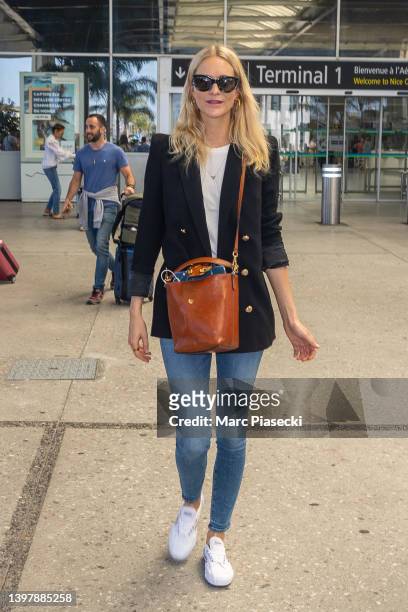Model Poppy Delevingne is seen arriving ahead of the 75th annual Cannes film festival at Nice Airport on May 18, 2022 in Nice, France.