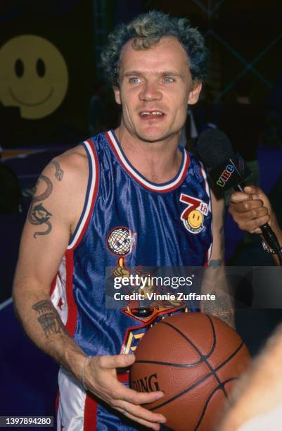 Australian-born America musician and actor Flea , wearing the blue singlet of the Bricklayers, at the 7th Annual MTV Rock N' Jock B-Ball Jam, in Los...