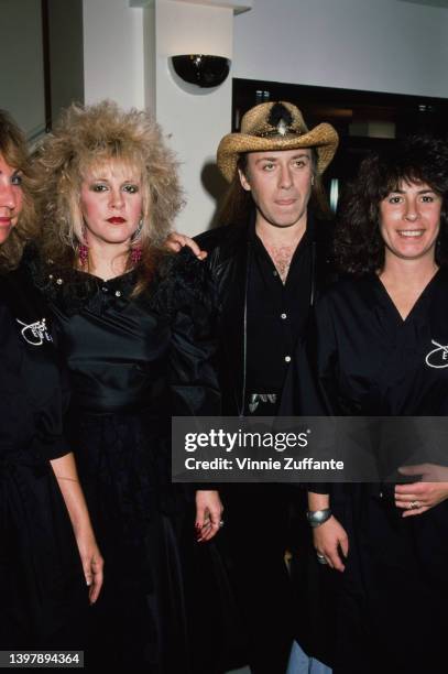 American singer and songwriter Stevie Nicks with French hair stylist Jose Eber between two models, at the Jose Eber Hair Salon in the Beverly Center,...