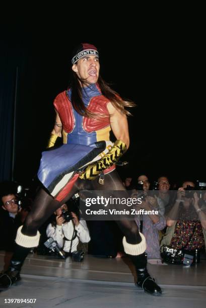 American singer, songwriter and musician Anthony Kiedis on the catwalk with photographers below the catwalk during the Jean Paul Gaultier Fashion...