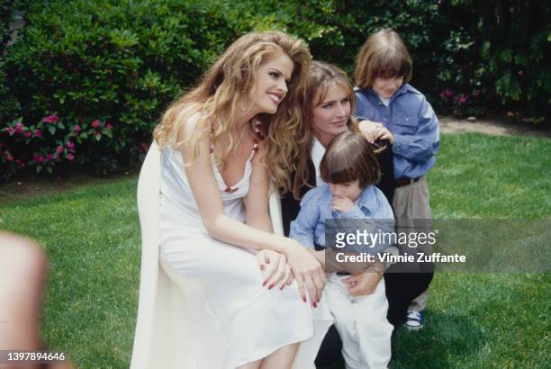 American model Rhonda Adams with American model and actress Kimberley Conrad and her sons, Marston Hefner and Cooper Hefner, attend the Playboy...